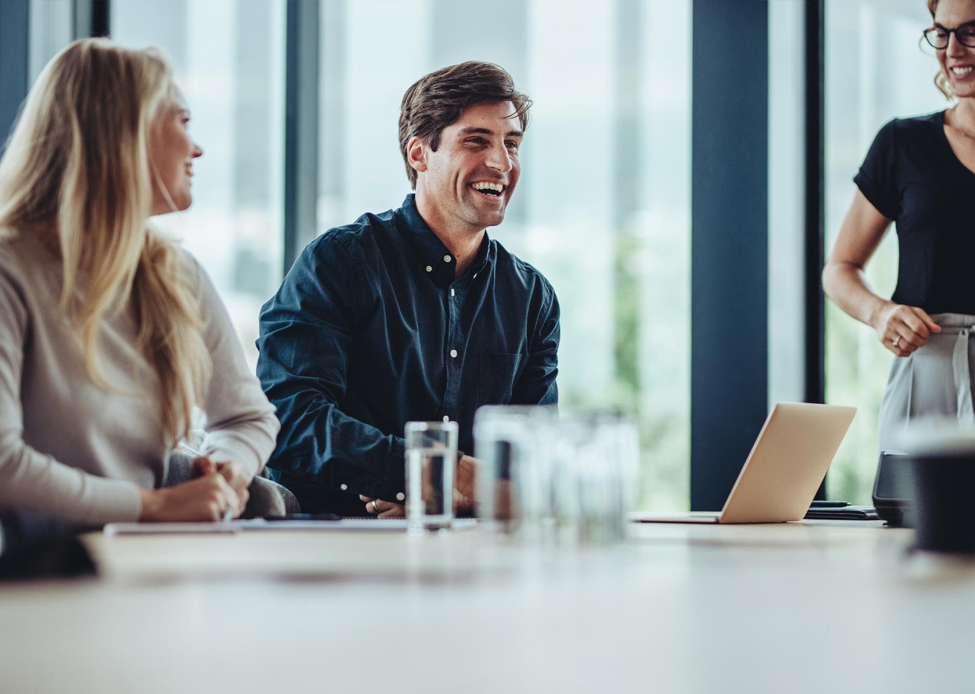 A YFM Equity Partners team member enjoying conversation in a meeting